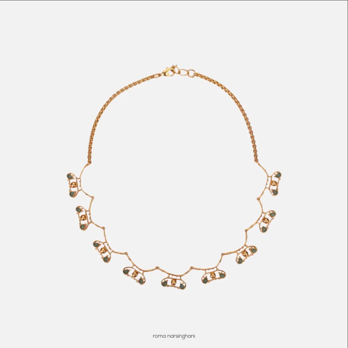 Roma Narsinghani Infinity choker Choker The piece is set in brass, hand enameled with 18KT gold finesse. Each piece is unique and handcrafted by our artisans. RNLOVE18