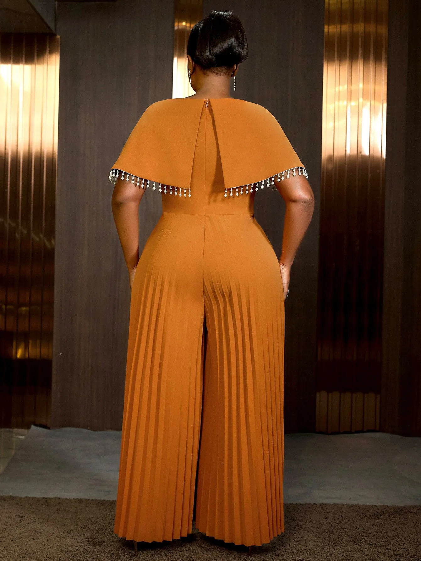Sophisticated Cape Sleeve Jumpsuit with Pleated Skirt Overlay